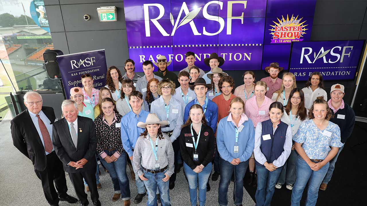RASF donors, scholars, members and staff posing at the RAS Foundation morning tea at ENGIE Stadium's Skydeck.