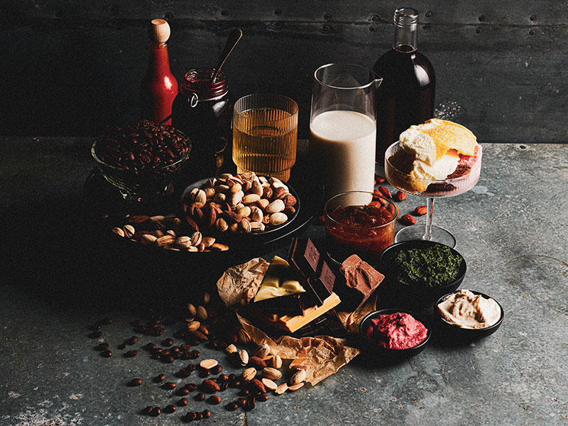 A selection of nuts, chocolate, dairy, and condiments displayed for the Sydney Royal Speciality Foods Show.
